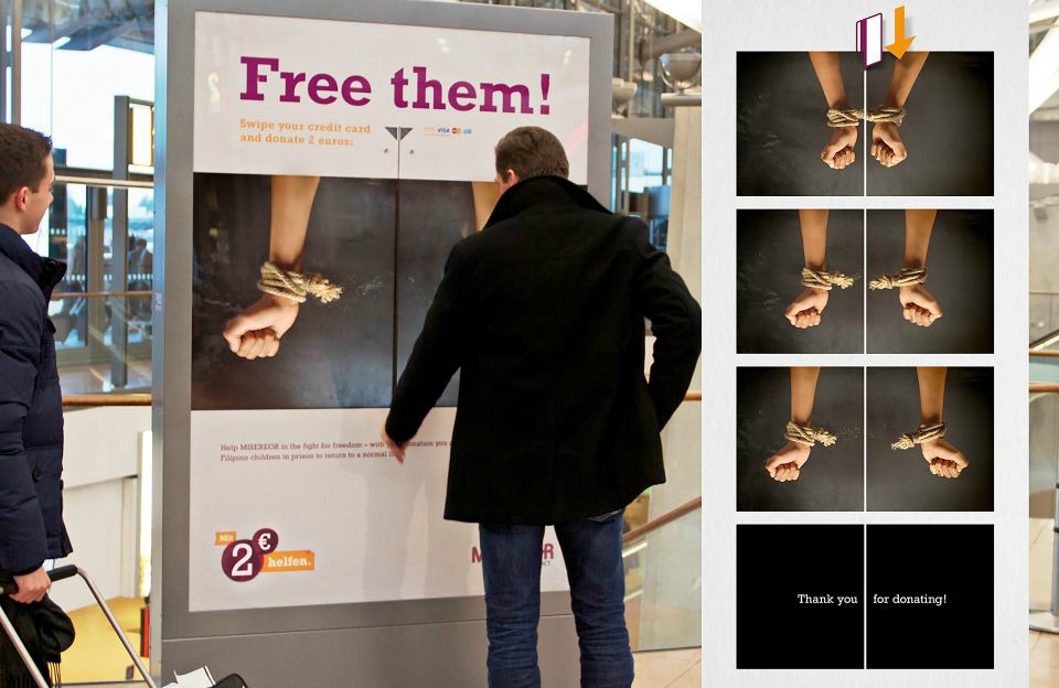 Man standing in front of ad campaign for Free them