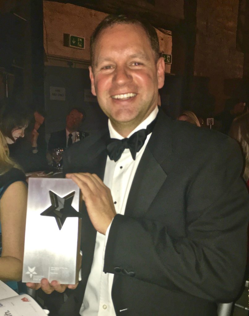 Kyle Hardie holding the Star Award