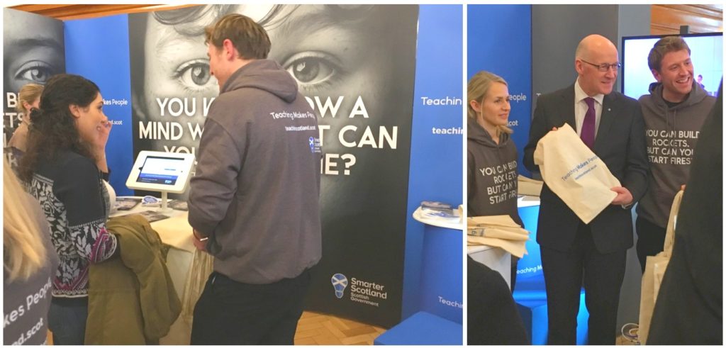 Display stand for STEM, man talking to woman about display