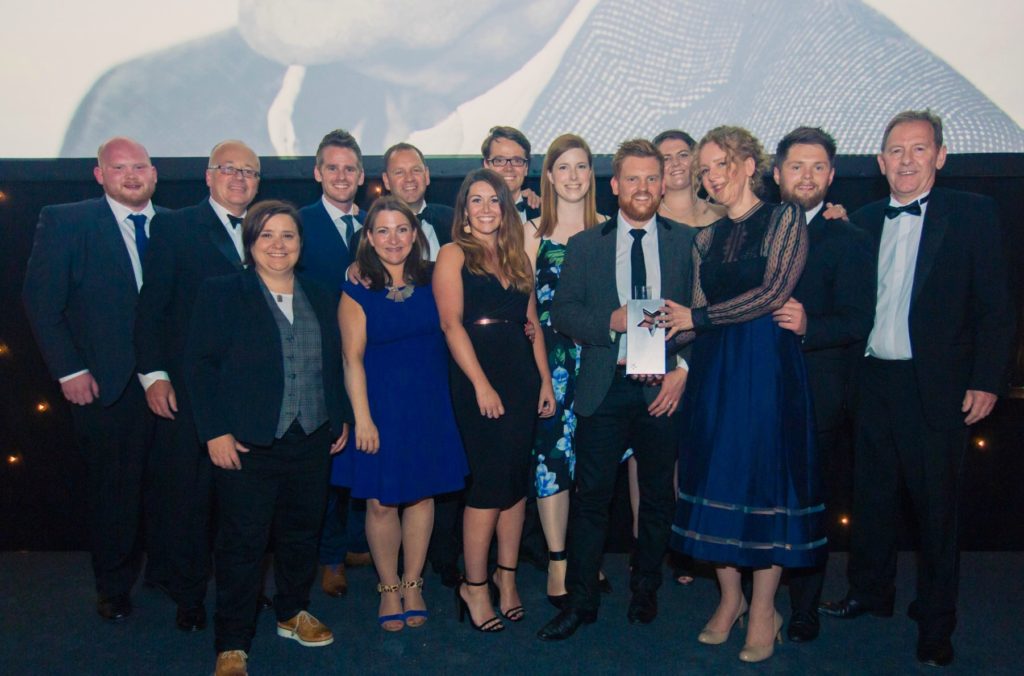 Union team on stage, group photo facing to camera at award night