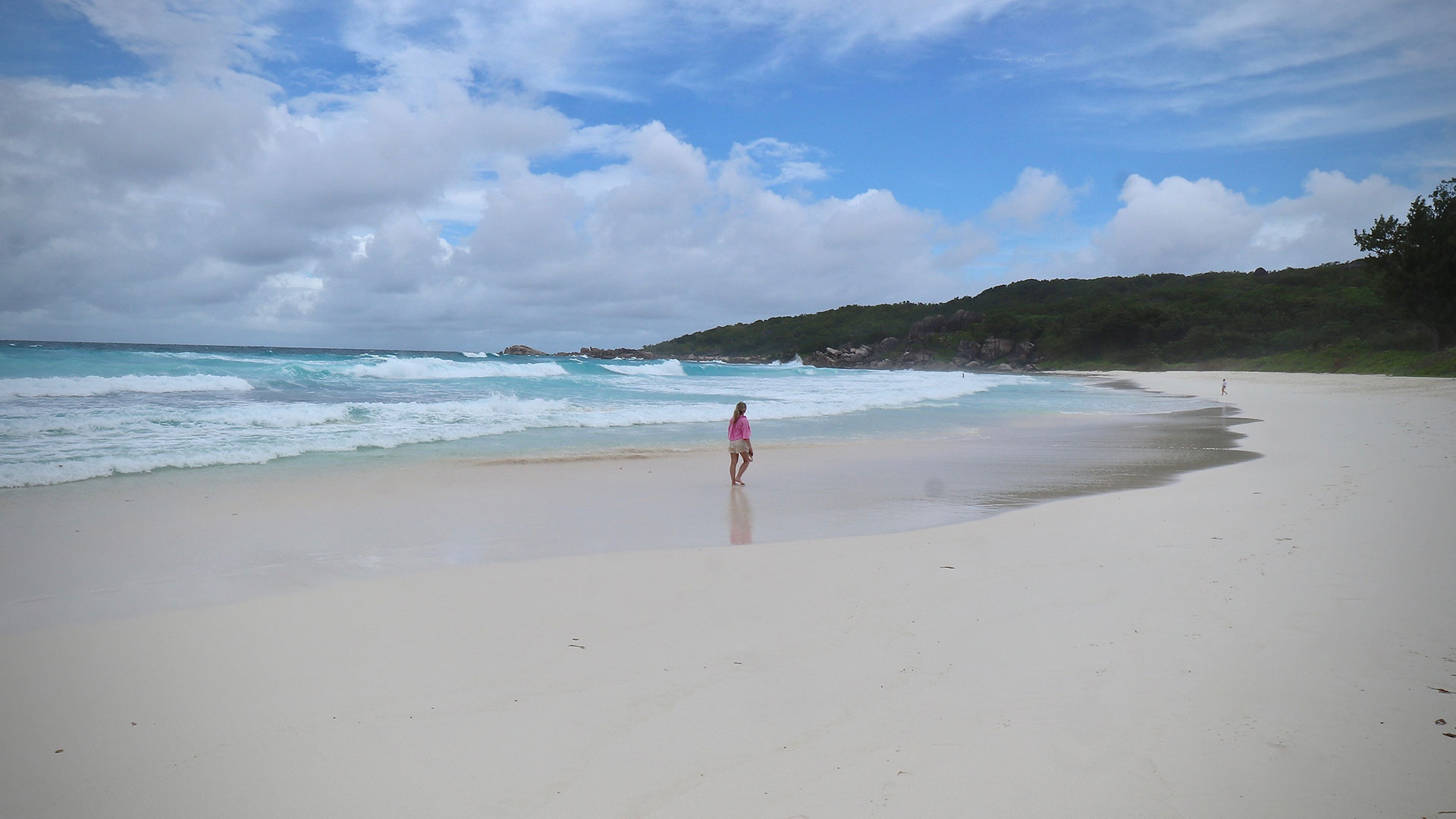 Female walking on beach front