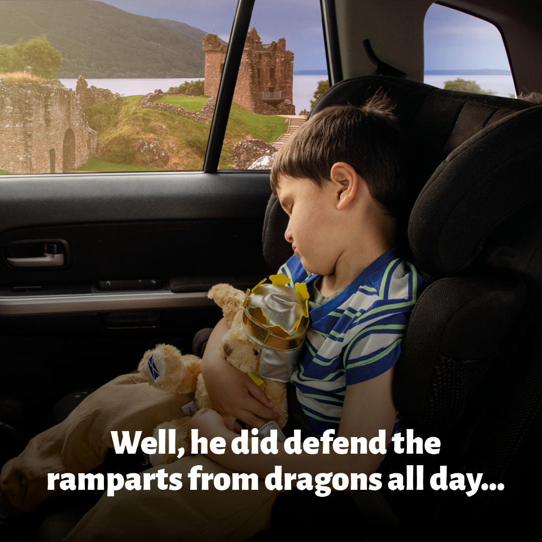 Boy sleeping in car