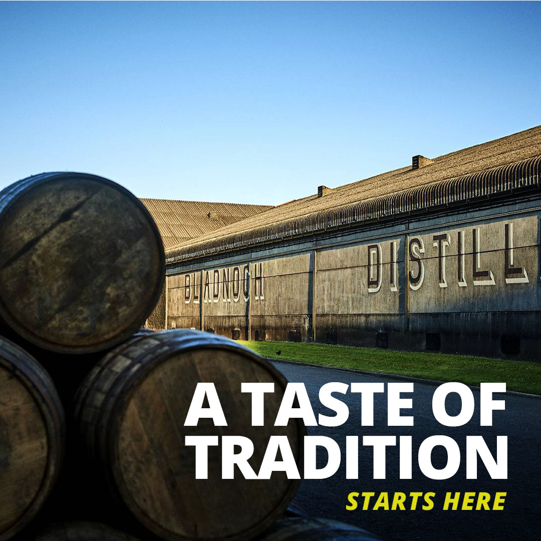 Ad with distillery in it with barrels in the forefront