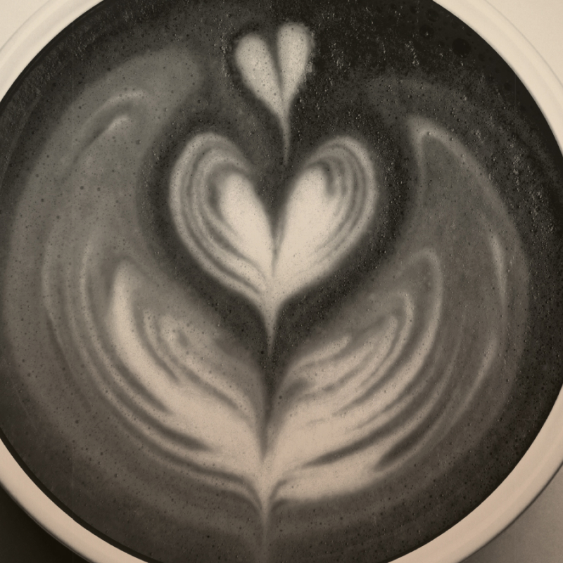 Coffee cup from above, with heart design in foam