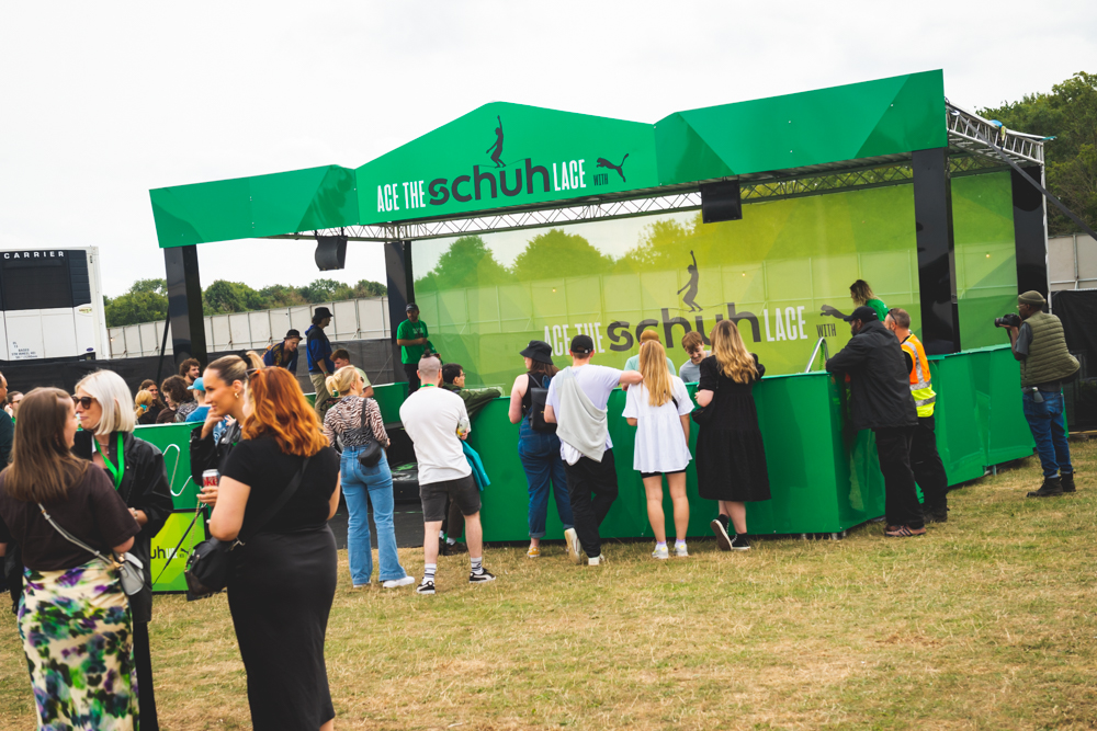 Banner stand surrounded by people watching display