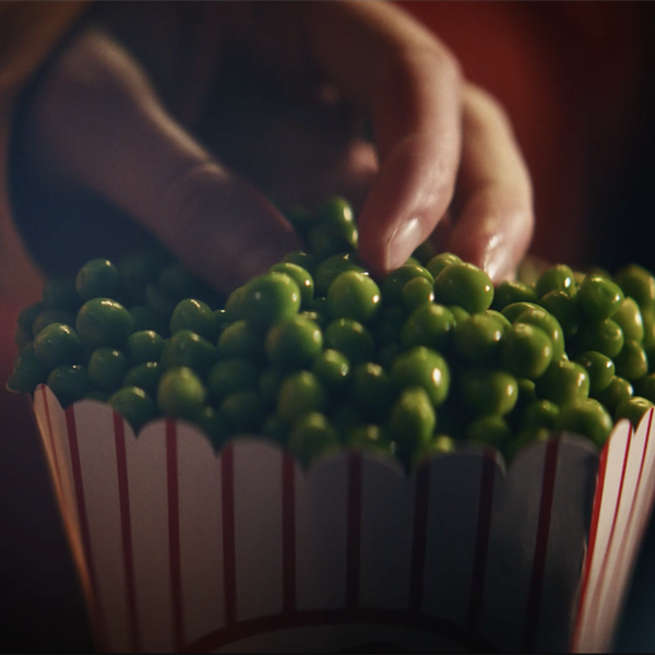 Popcorn tub filled with peas