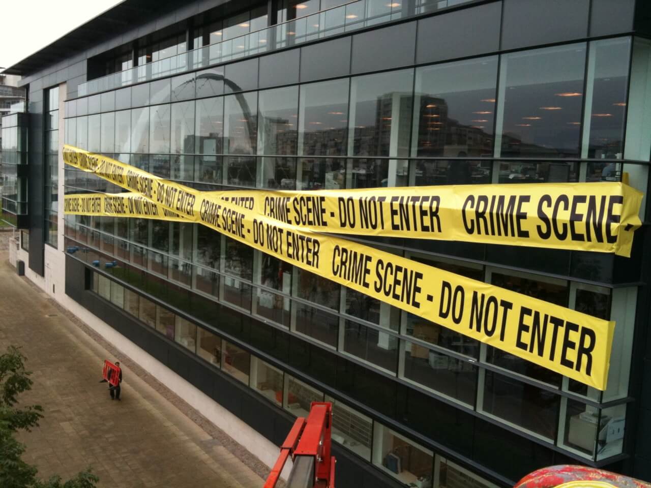 crime scene tape as part of ad campaign on wall