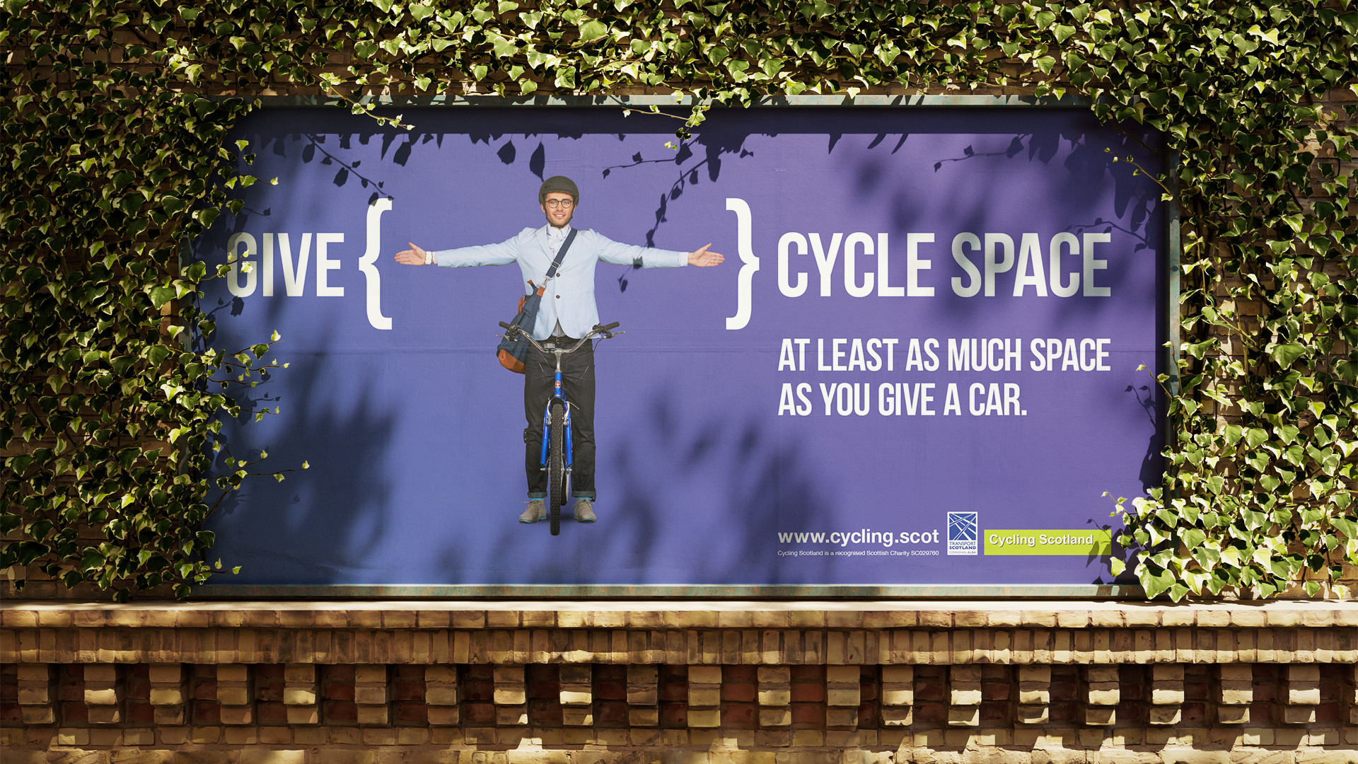 Billboard poster of ad with a young proffesional on bike with arms stretched out