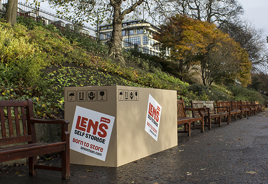 Lens Storage marketing campaign with items on the street boxed up