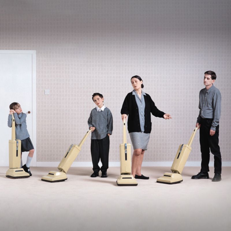 Family holding hoovers