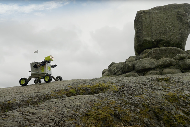 image of TAM the robot on a hill